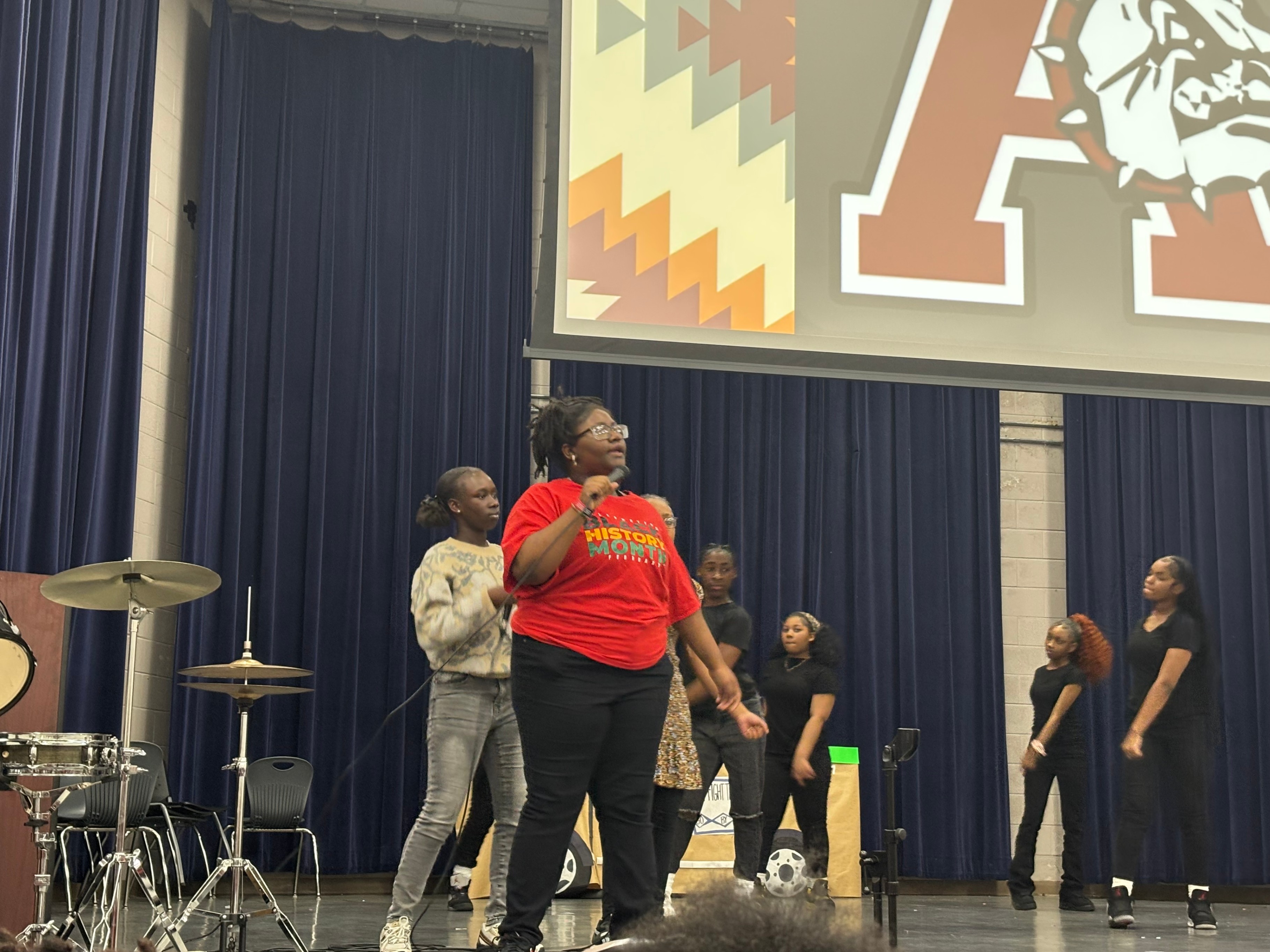 AMS students singing during a Black History Presentation. 